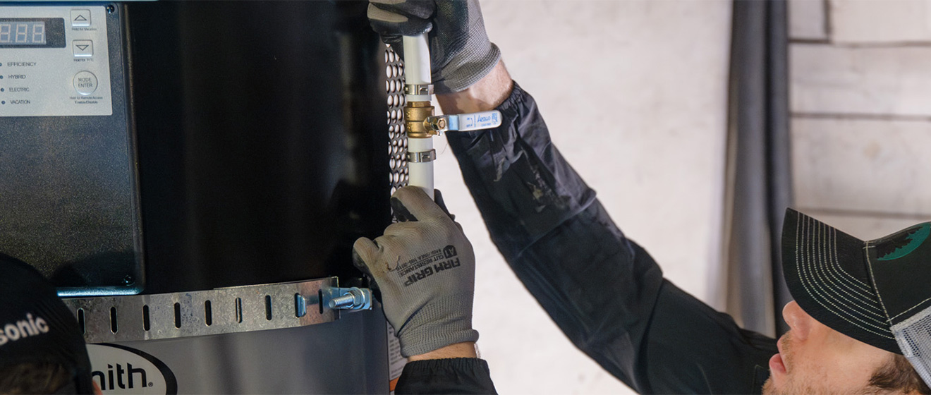 Technician working on water heater